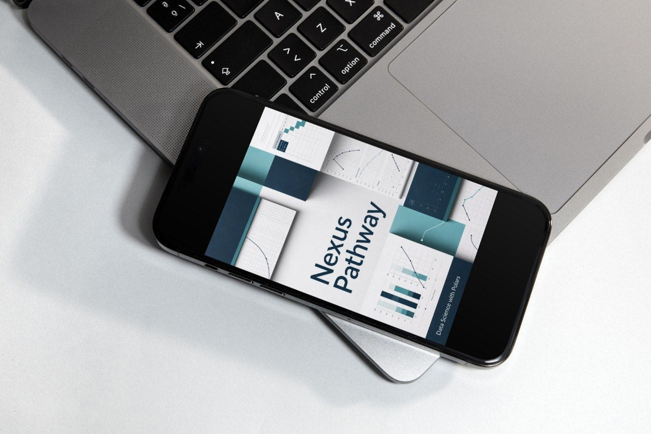 A smartphone lying on a white surface next to a silver laptop, displaying a course cover titled 'Flow Course' with abstract teal, white, and gray geometric graphics.